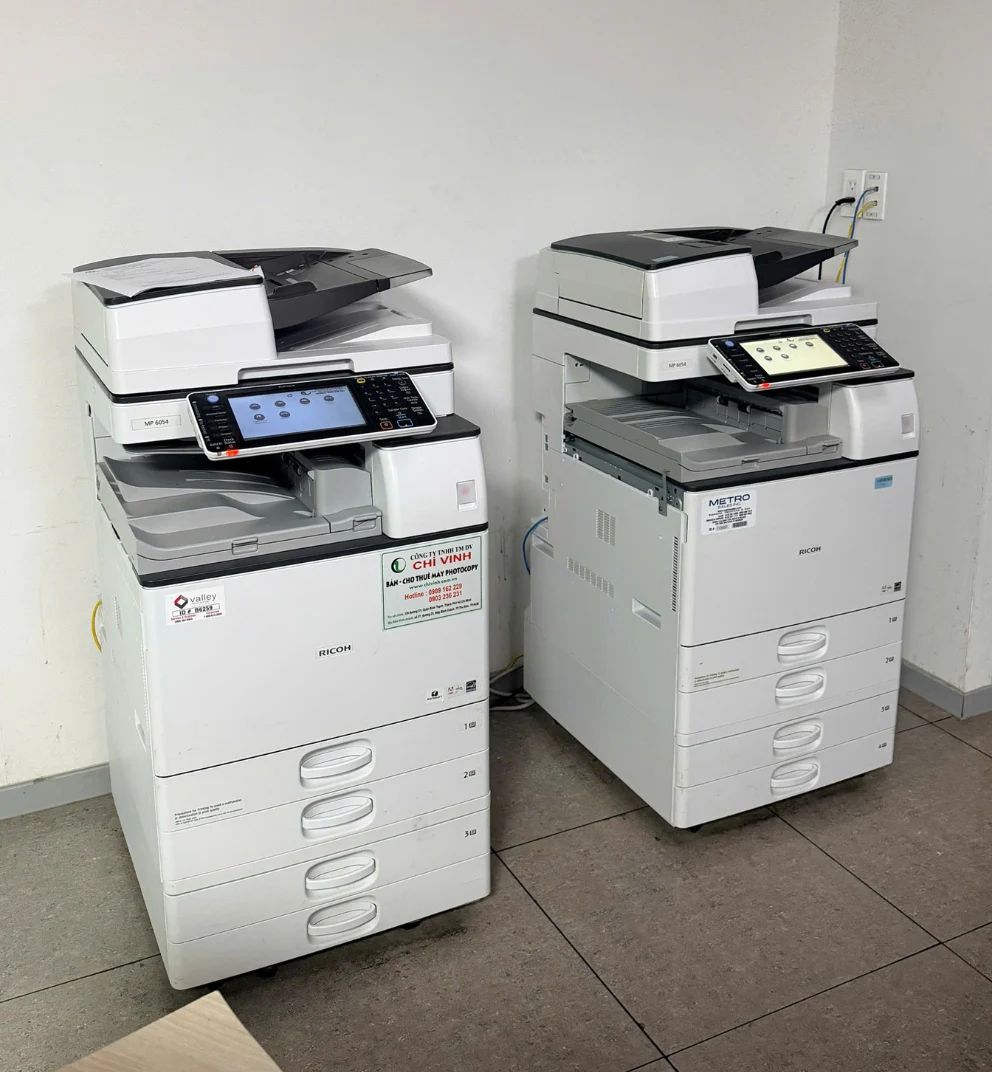Hai máy photocopy Ricoh MP 6054 cho thuê đặt song song tại văn phòng khách hàng